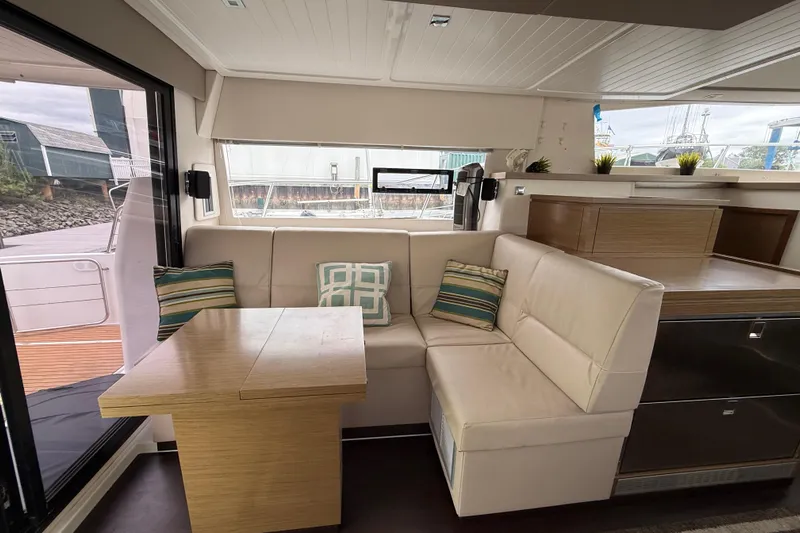 Ohana Yacht Photos Pics Interior of 2015 Fountaine Pajot Summerland 40 LC with cozy seating and table.