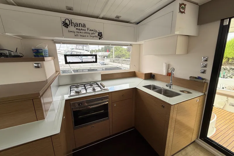 Ohana Yacht Photos Pics Modern kitchen in 2015 Fountaine Pajot Summerland 40 LC yacht with stove and sink.