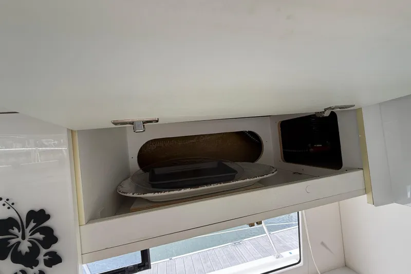 Ohana Yacht Photos Pics Cabinet interior on 2015 Fountaine Pajot Summerland 40 LC yacht, featuring storage space.