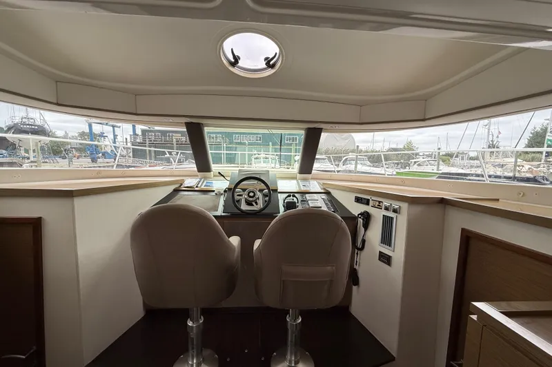 Ohana Yacht Photos Pics Interior helm of 2015 Fountaine Pajot Summerland 40 LC with dual seats and panoramic view.