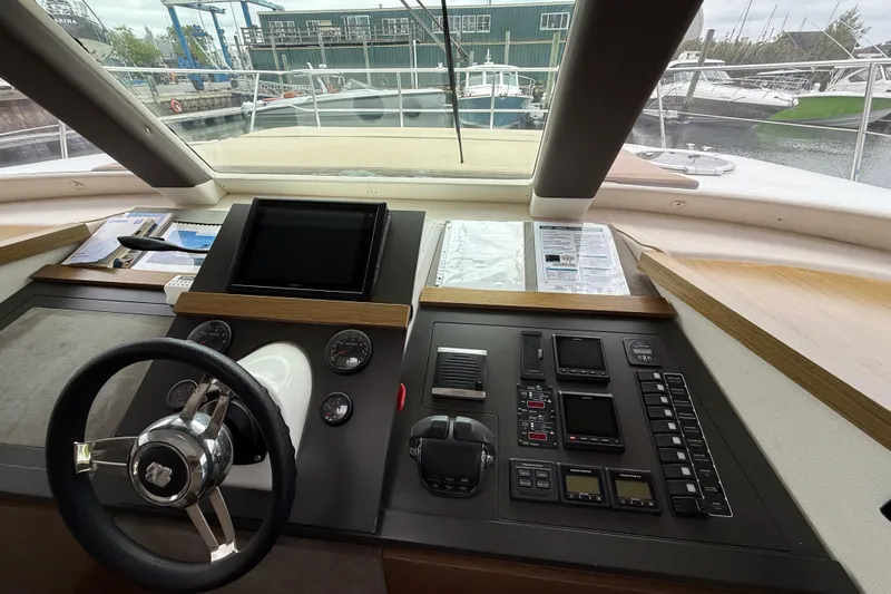 Ohana Yacht Photos Pics Cockpit of 2015 Fountaine Pajot Summerland 40 LC with steering wheel and control panel.