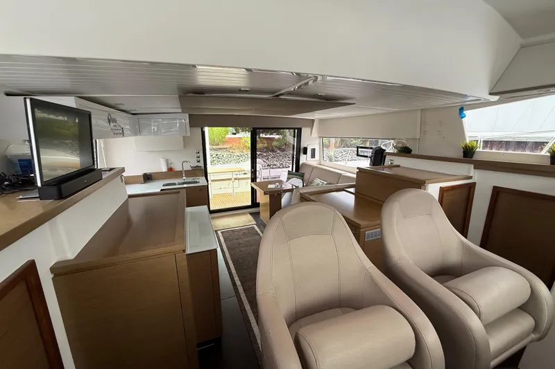 Ohana Yacht Photos Pics Interior of 2015 Fountaine Pajot Summerland 40 LC yacht with modern seating and kitchen area.