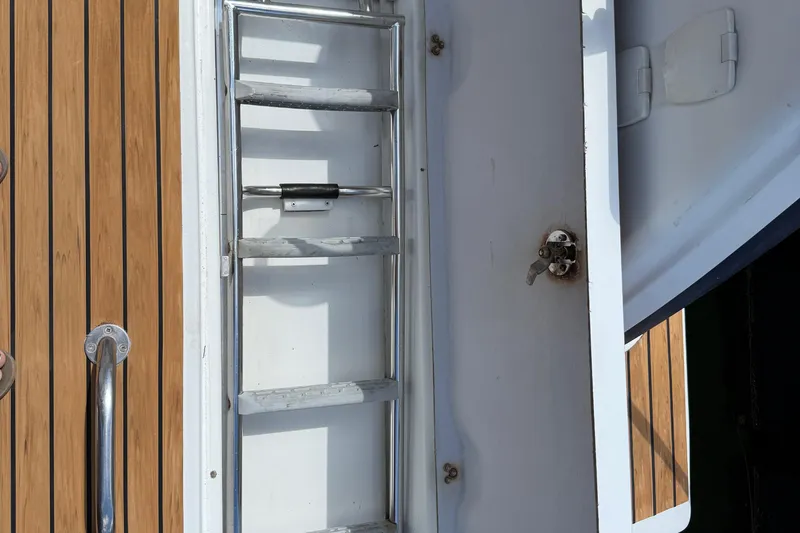 Ohana Yacht Photos Pics swim ladder - 2015 Fountaine Pajot Summerland 40 LC boat ladder and teak deck detail.