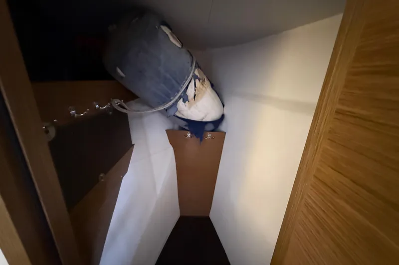 Ohana Yacht Photos Pics Storage area inside 2015 Fountaine Pajot Summerland 40 LC boat, featuring a large bag.