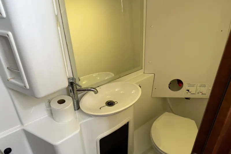 Ohana Yacht Photos Pics Bathroom interior of 2015 Fountaine Pajot Summerland 40 LC yacht, featuring sink and toilet.