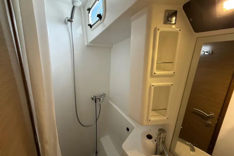 Ohana Yacht Photos Pics Bathroom interior of 2015 Fountaine Pajot Summerland 40 LC yacht, featuring shower and sink.