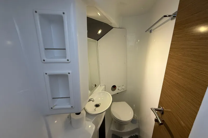 Ohana Yacht Photos Pics Bathroom interior of 2015 Fountaine Pajot Summerland 40 LC yacht, featuring modern fixtures.