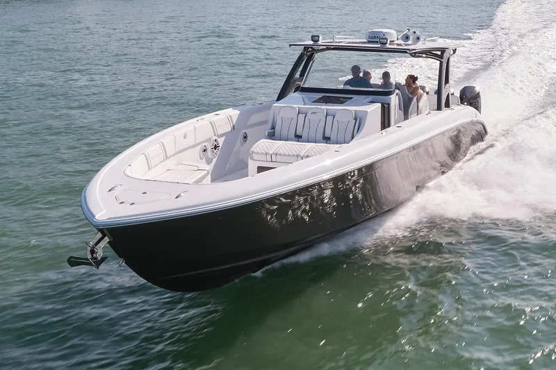  Yacht Photos Pics 2021 Midnight Express 43' Open boat cruising on water with passengers onboard.