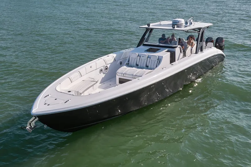  Yacht Photos Pics 2021 Midnight Express 43' Open boat cruising on water with passengers.