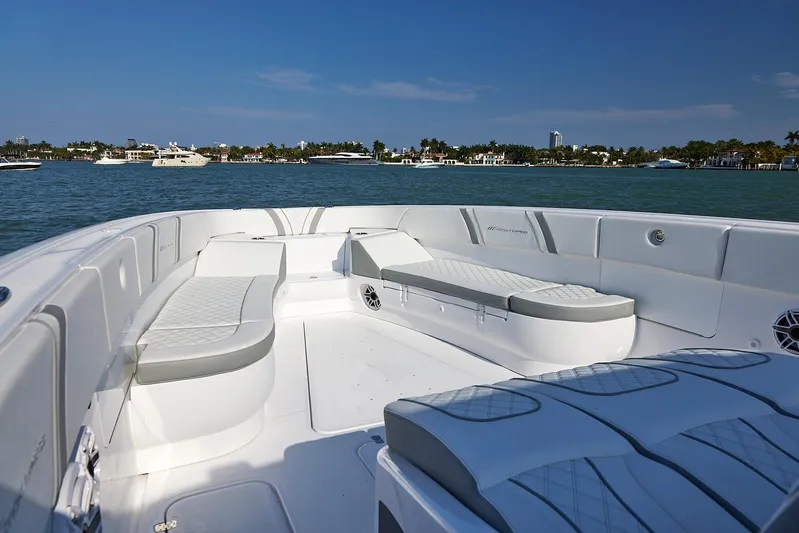  Yacht Photos Pics 2021 Midnight Express 43' Open boat interior with luxurious seating on a sunny day.