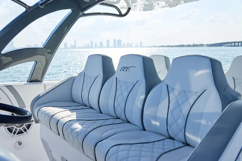  Yacht Photos Pics Luxurious seating on a 2021 Midnight Express 43' Open boat with city skyline view.