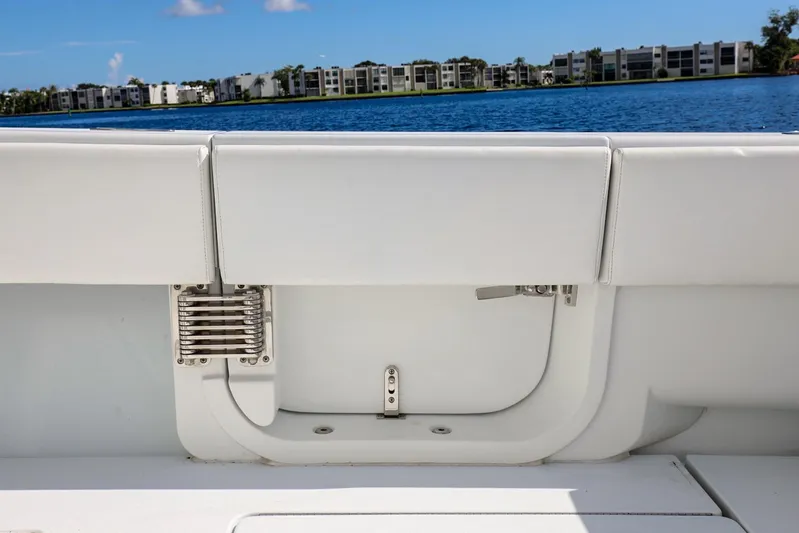  Yacht Photos Pics 2023 Contender 44 ST boat interior with white seating and lake view.
