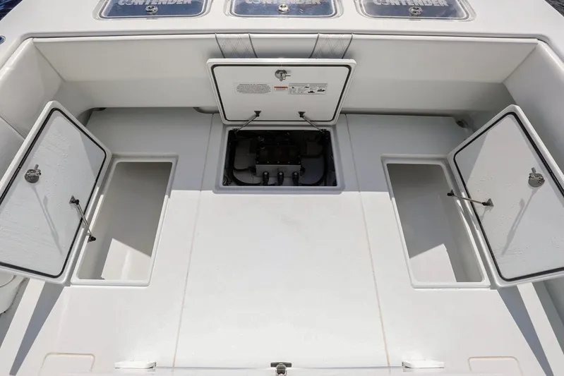  Yacht Photos Pics 2023 Contender 44 ST boat deck with open storage compartments.