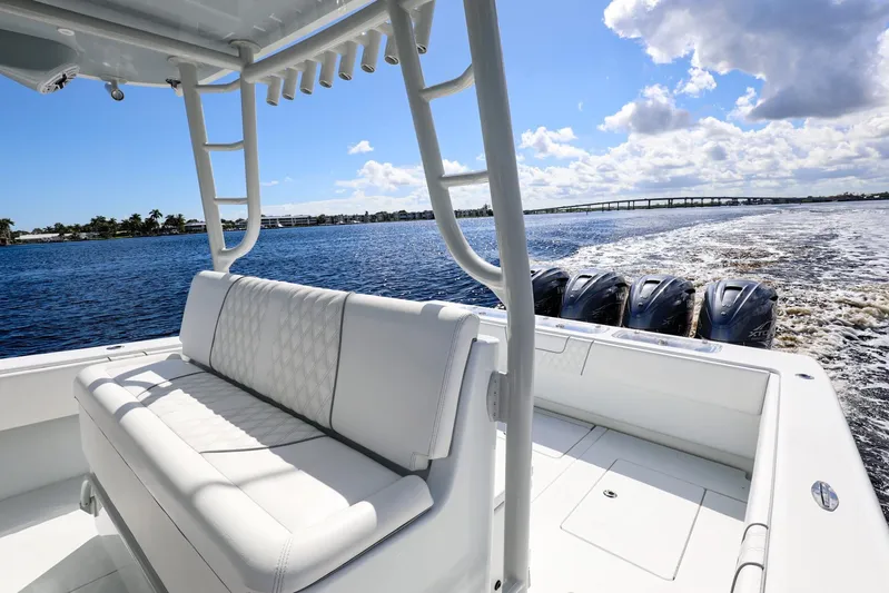  Yacht Photos Pics 2023 Contender 44 ST boat with powerful engines cruising on a sunny day.