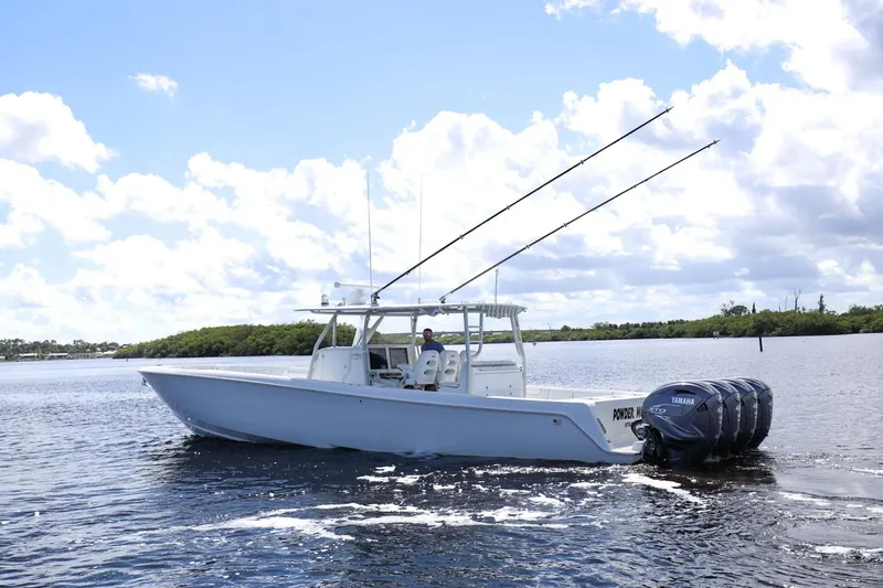  Yacht Photos Pics 2023 Contender 44 ST boat with Yamaha engines on a sunny day.