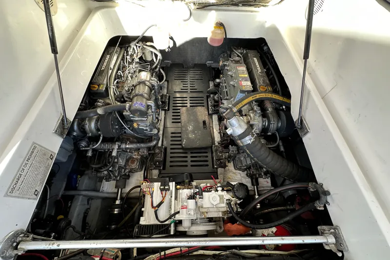  Yacht Photos Pics Engine compartment of a 2002 Mainship Pilot 34 boat, showcasing dual engines and mechanical components.
