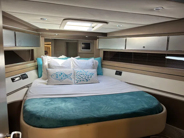 (2021 And 2024 Retrofit) Yacht Photos Pics Luxurious cabin interior of a 2003 Riva 52' le yacht with elegant bedding.