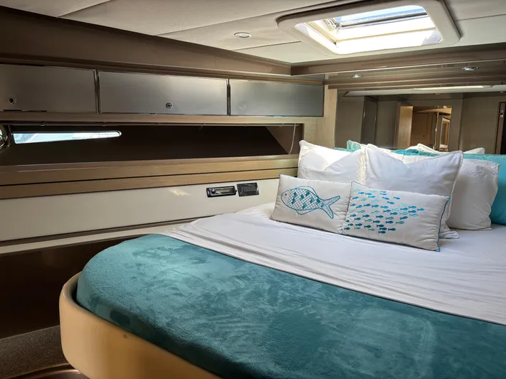 (2021 And 2024 Retrofit) Yacht Photos Pics Luxurious cabin interior of a 2003 Riva 52' LE yacht with elegant bedding.