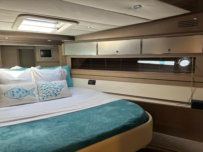 (2021 And 2024 Retrofit) Yacht Photos Pics Luxurious cabin interior of a 2003 Riva 52' LE yacht with elegant bedding.