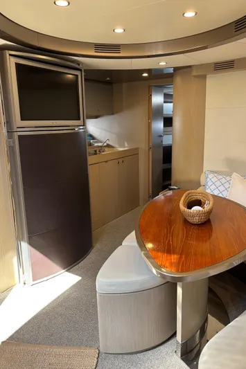 (2021 And 2024 Retrofit) Yacht Photos Pics Luxurious interior of a 2003 Riva 52' LE yacht with modern furnishings.