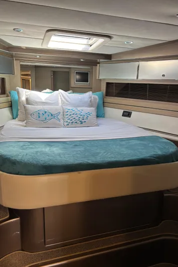 (2021 And 2024 Retrofit) Yacht Photos Pics Luxurious cabin interior of a 2003 Riva 52' LE yacht with elegant bedding.