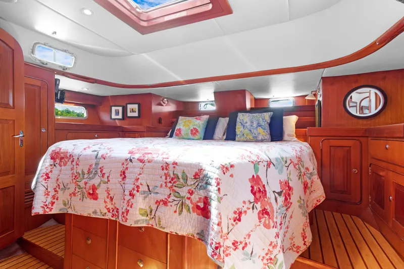 Mrs Jones Yacht Photos Pics Luxurious 2009 Hylas 54 yacht cabin with floral bedding and wooden interior.