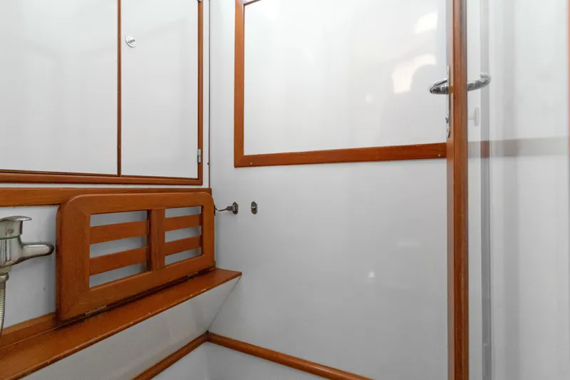 Mrs Jones Yacht Photos Pics Interior of 2009 Hylas 54 yacht featuring wooden trim and white paneling.