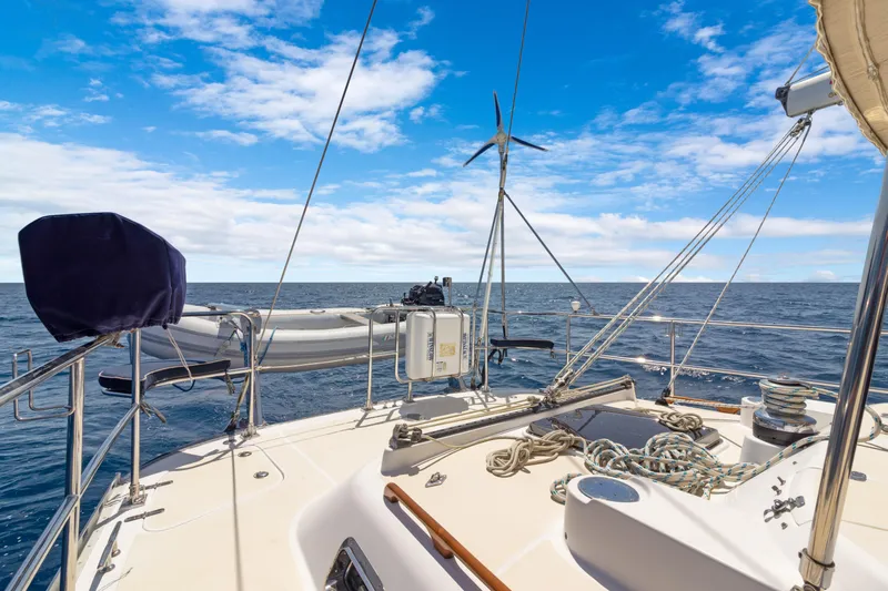 Mrs Jones Yacht Photos Pics Sailing on a 2009 Hylas 54 yacht, open sea view, clear blue sky.