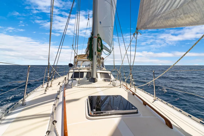 Mrs Jones Yacht Photos Pics Sailing on a 2009 Hylas 54 yacht under clear blue skies.