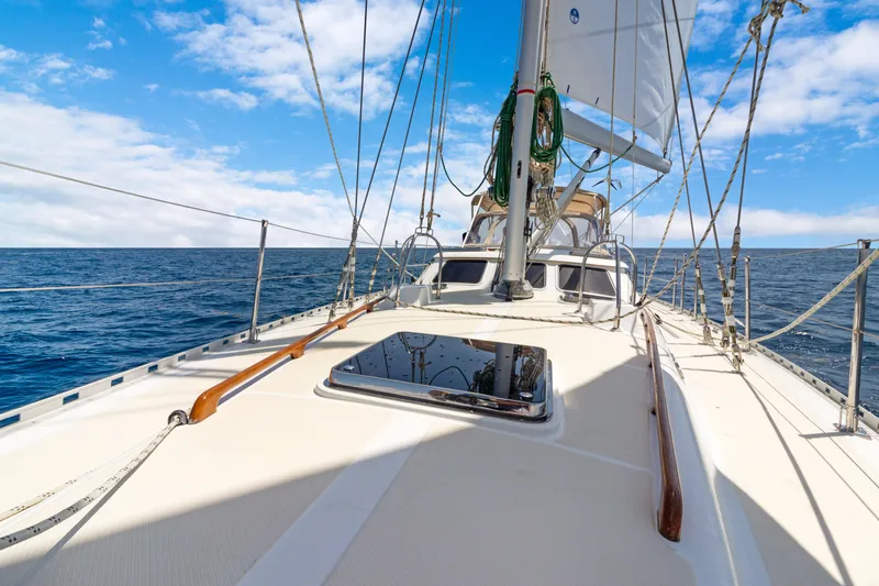 Mrs Jones Yacht Photos Pics Sailing on a 2009 Hylas 54 yacht under clear blue skies.