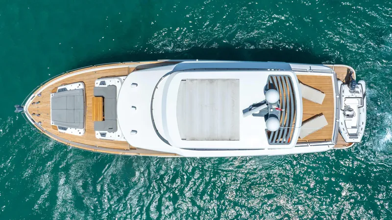 Sand Bar Yacht Photos Pics Aerial view of 2018 Sirena 64 yacht cruising on turquoise waters.