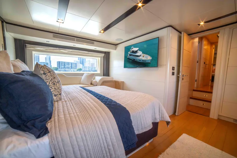 Sand Bar Yacht Photos Pics Luxurious bedroom interior of 2018 Sirena 64 yacht with city view.