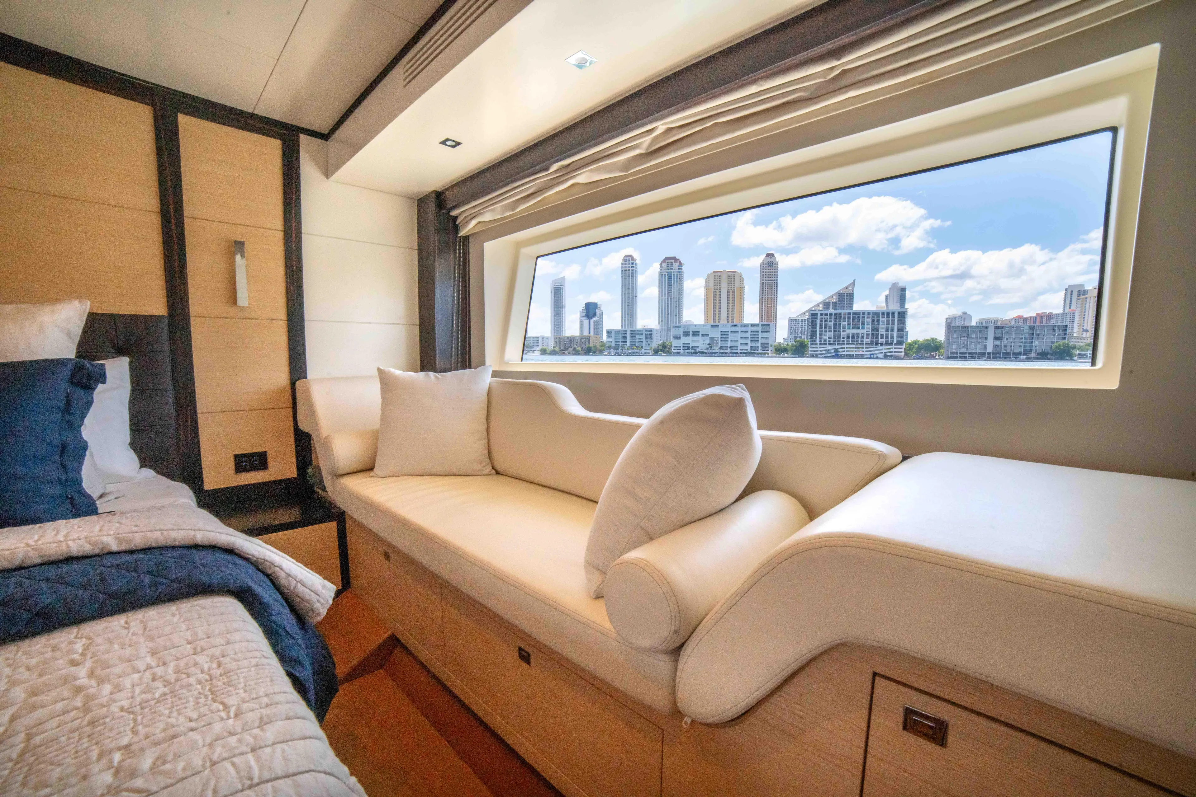 Sand Bar Yacht Photos Pics Luxurious interior of 2018 Sirena 64 yacht with city skyline view.