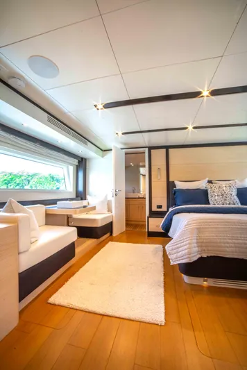 Sand Bar Yacht Photos Pics Luxurious interior of 2018 Sirena 64 yacht with modern bedroom and seating area.