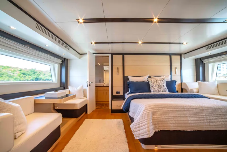 Sand Bar Yacht Photos Pics Luxurious master cabin interior of 2018 Sirena 64 yacht with modern decor and large windows.