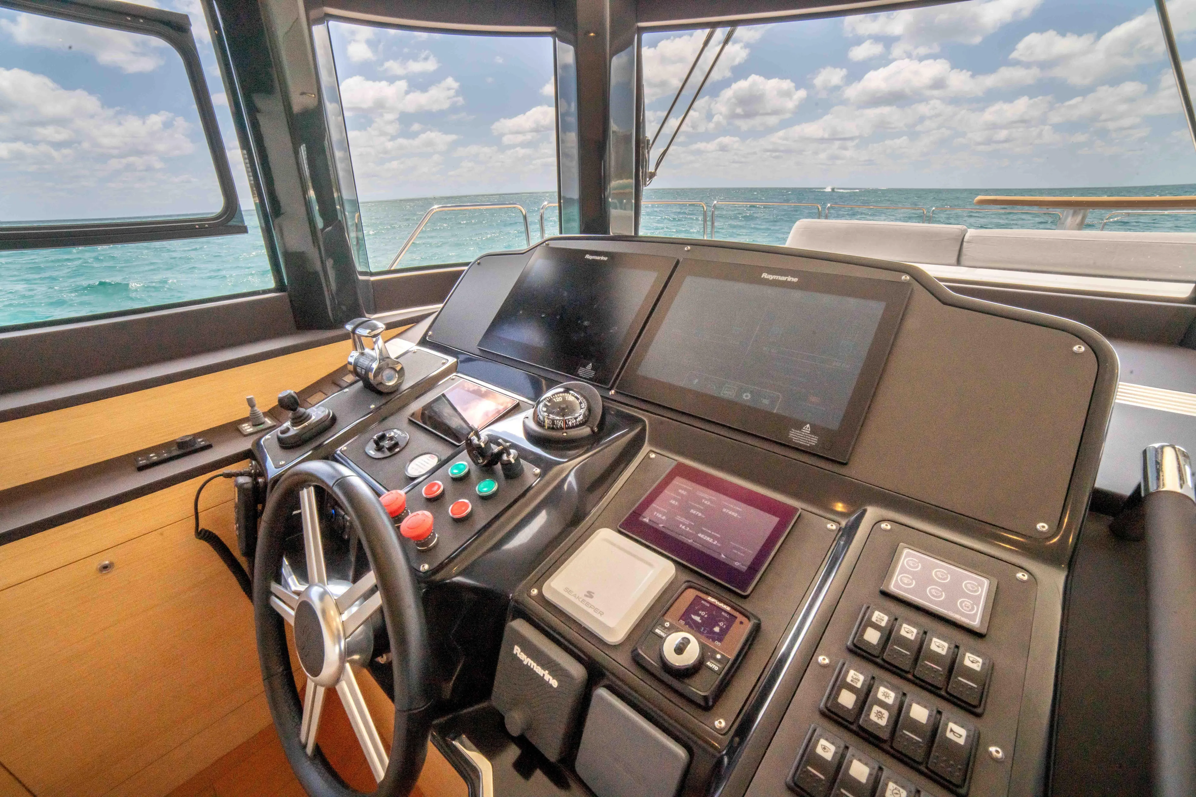 Sand Bar Yacht Photos Pics Helm station of 2018 Sirena 64 yacht with ocean view.