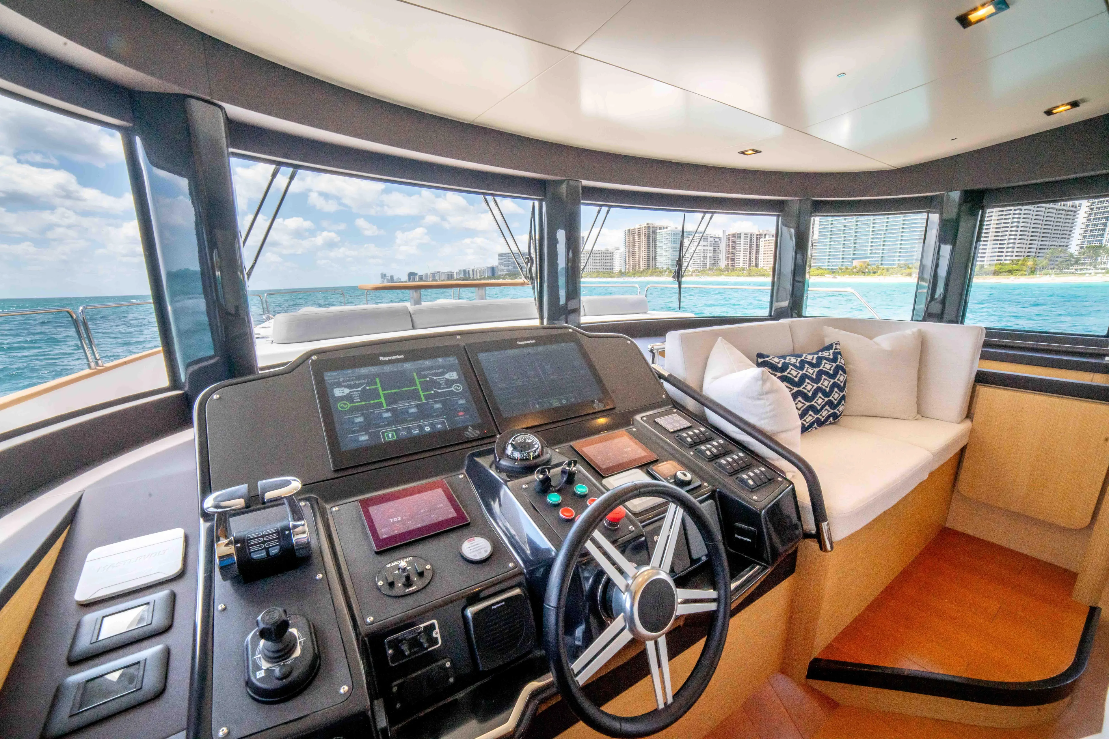 Sand Bar Yacht Photos Pics 2018 Sirena 64 yacht helm station with ocean view and city skyline.