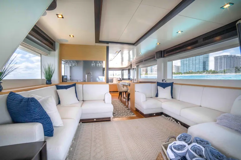 Sand Bar Yacht Photos Pics Luxurious interior of 2018 Sirena 64 yacht with white sofas and ocean view.