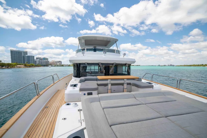 Sand Bar Yacht Photos Pics 2018 Sirena 64 yacht with spacious deck and scenic waterfront view.