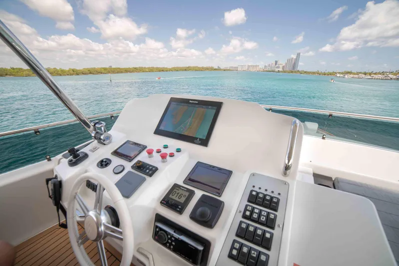 Sand Bar Yacht Photos Pics Control panel of a 2018 Sirena 64 yacht with ocean view.