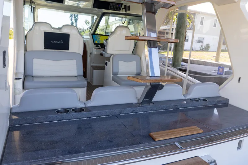  Yacht Photos Pics 2020 Scout 530LXF boat interior with seating, helm, and modern amenities.