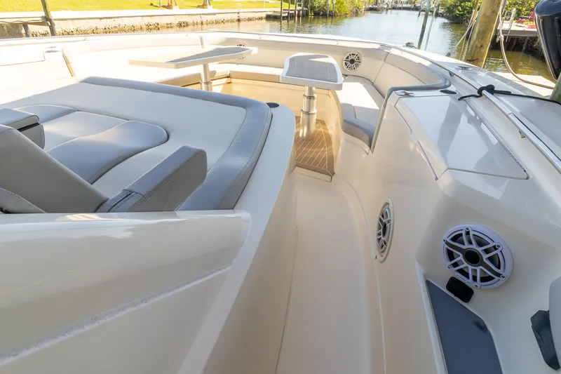  Yacht Photos Pics 2020 Scout 530LXF boat interior with seating and table, showcasing luxury design.