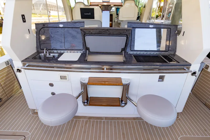  Yacht Photos Pics 2020 Scout 530LXF yacht interior with modern kitchen amenities and seating.
