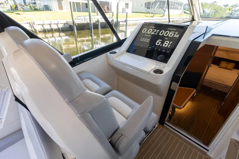  Yacht Photos Pics 2020 Scout 530LXF boat interior with modern dashboard and seating.