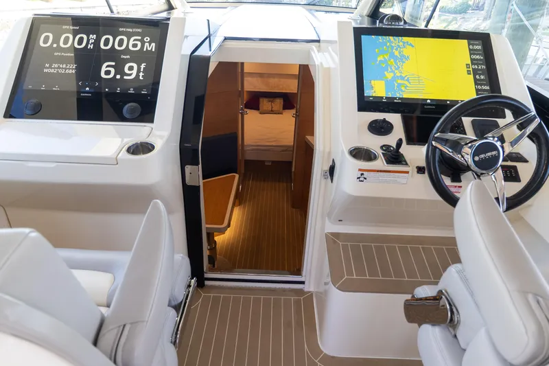  Yacht Photos Pics 2020 Scout 530LXF boat cockpit with advanced navigation displays and luxurious interior view.