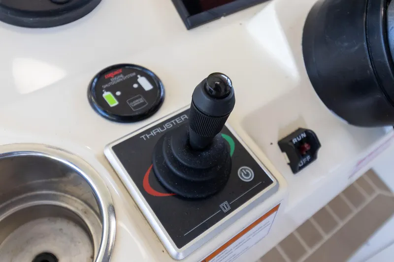  Yacht Photos Pics Control panel of 2020 Scout 530LXF boat featuring a thruster joystick.
