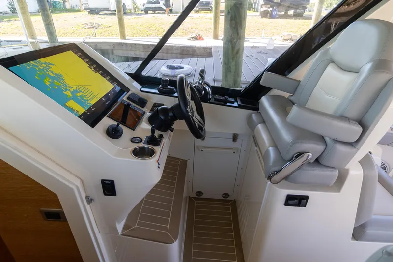  Yacht Photos Pics 2020 Scout 530LXF helm with navigation display and comfortable seating.