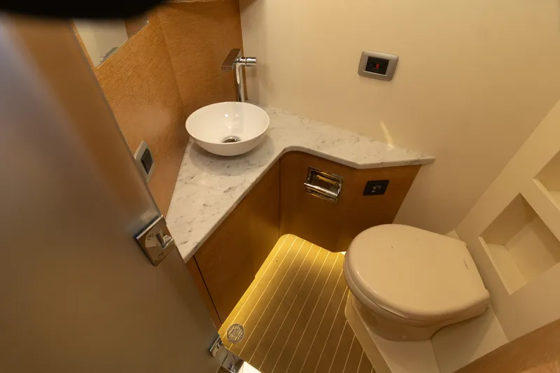  Yacht Photos Pics Luxurious bathroom in 2020 Scout 530LXF boat with modern fixtures and marble countertop.