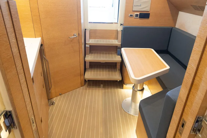  Yacht Photos Pics 2020 Scout 530LXF interior with wooden flooring, compact dining area, and modern design.