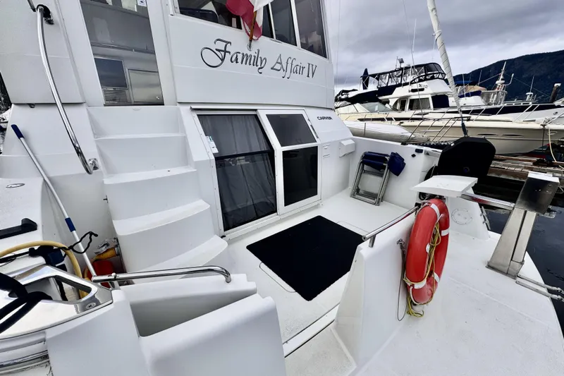 Family Affair IV Yacht Photos Pics 1997 Carver 500 Cockpit Motor Yacht docked, featuring spacious deck and safety equipment.